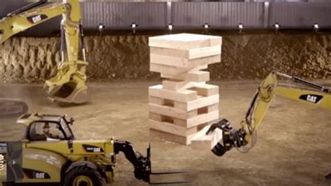 skid steer playing jenga|BangShift.com Caterpillar machines play Jenga in this video.